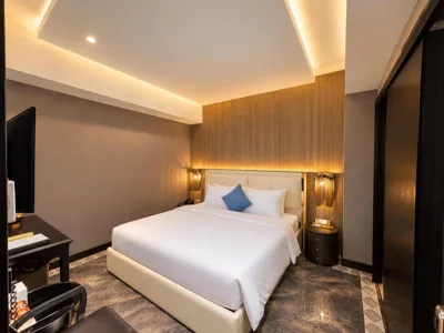 Senior-Deluxe-Doppelzimmer ohne Fenster – Afternoon Tea — A&EM Ben Thanh Hotel